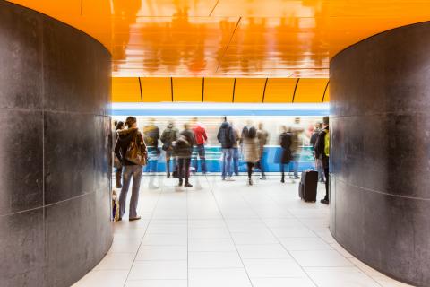 people-rushing-through-a-subway-corridor-motion-blur